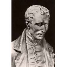 Statue of Louis Braille from the chest up.