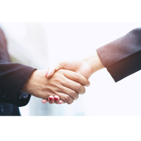 close up of two people shaking hands