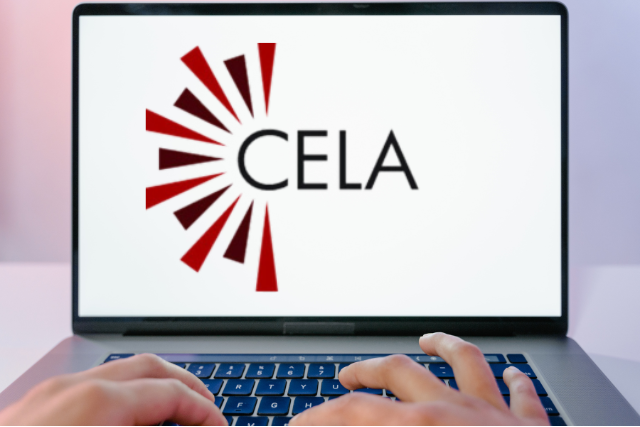 Fingers type on a laptop keyboard with the CELA logo displayed on the screen.