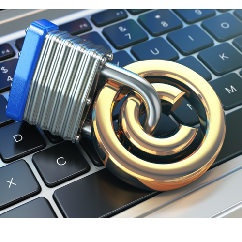 The C copyright symbol is attached to a padlock and lies on a computer keyboard.