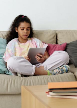 Girl reading on tablet